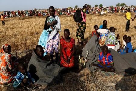 Women and children wait to be registered prior to a food distribution carried out by the United Nations World Food Programme (WFP) in Thonyor, Leer state, South Sudan, February 25, 2017.